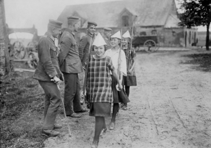Girls parade with paper helmets, 1925 (b/w photo)