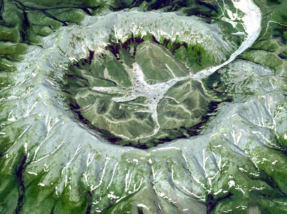 Kondyor Massif, located in Eastern Siberia, Russia, north of the city of Khabarovsk. It is a rare form of igneous intrusion called alkaline-ultrabasic massif. June 10, 2006. Satellite image.
