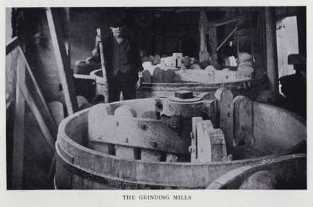 The grinding mills at a pottery factory (b/w photo)