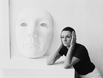 Sculptor Glenys Barton with one of her artworks, 1989 (b/w photo)