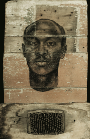 Nkisi, 2001 (charcoal on wood with found object)