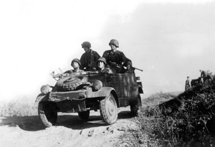 Soldiers of the Waffen-SS in a bucket car (b/w photo)