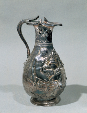Two victories sacrificing a bull on an altar;they wear the palladion, a small statue of Athena …