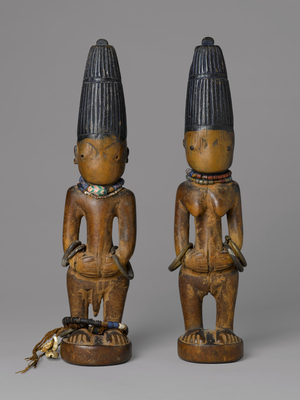 Pair of Ibeji Figures, late 19th-early 20th century (wood, pigment, beads, metal, cowrie shells)
