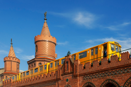 S-bahn train over Oberbaum bridge Oberbaumbrucke in  Friedrichshain Kreuzberg Berlin, Germany, Europe (photo)