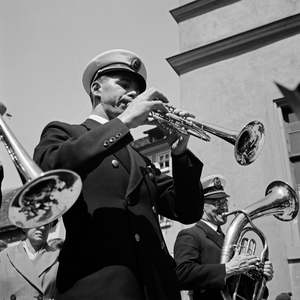 Trumpet player at a pageant, Germany 1930s (b/w photo)