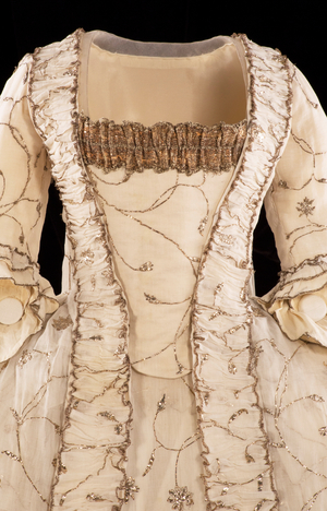 Muslin sack-back court dress, c.1780 (Indian cotton muslin embroidered with silver wire & silver strip, trimmed with silver lace & gimp)
