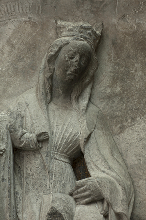 Cathedral collection. Bas-Relief. Polychromed stone. Devotion monument of Jean Dubois (Monument votif de Jean Dubos). Origin of the brotherhood (Frères Mineurs de Tournai). Ca 1440. Detail bust of a woman.
