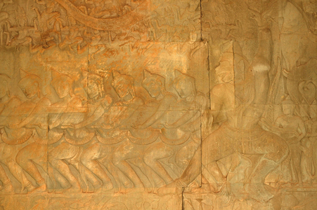 Churning of the Ocean of Milk carving, gods with crested helmets and Hanuman (monkey god), Budhhist-Hindu Temple, Angkor Wat, Siem Reap 12th. c. Cambodia