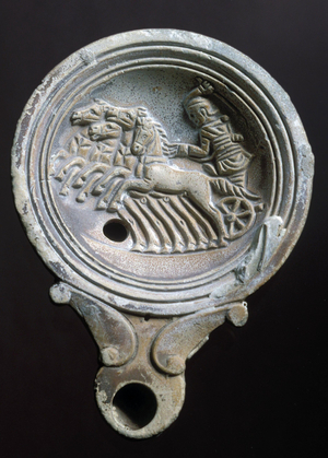Oil lamp depicting a racing carriage with four horses (terracotta)