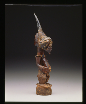 Standing male figure (nkishi) (wood, metal, horn, cord and beads)