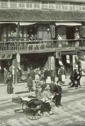 China, c 1909: A Street in Shanghai (b/w photo)