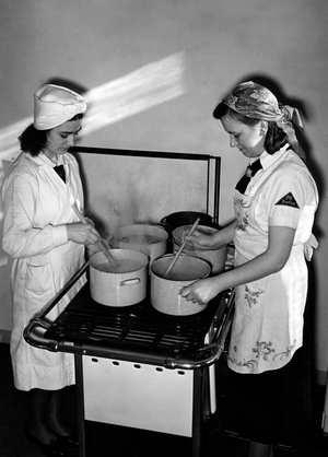 Members of the BDM-Werk Glaube und Schoenheit (BDM-Work, Faith and Beauty Society) when baking, Berlin 1941 (b/w photo)