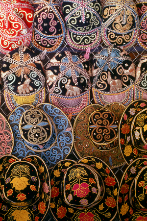 Thailand / Burma: Elaborately sequinned Burmese caps for sale at the Mae Sot-Myawaddy border between Thailand and Myanmar (Burma)