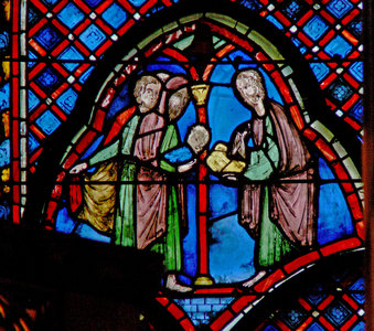 Window w9L  St John the Baptist: his father Zacharias writes the name of his son (stained glass)