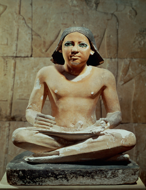 Seated scribe holding a scroll (sculpture)