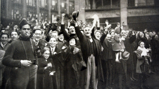 French crowds cheer American liberators in a town in Alsace Lorraine after liberation from Germany in World War Two