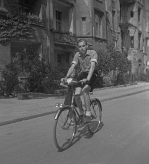 Man on a bicycle with radio in Berlin, Germany, c.1950 (photo)