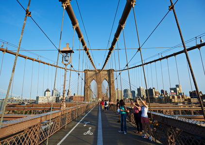Tourists taking photographs on Brooklyn Bridge, New York City, New York, USA (photo)