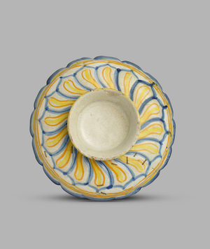 Fluted dish with a boy on horseback in the centre, c.1540-c.1550 (tin-glazed earthenware)