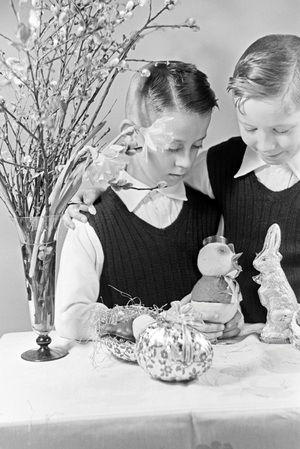 Two boys at a table with easter decoration, Germany 1930s (b/w photo)