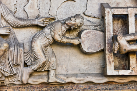 Genoa, Duomo (St Lawrence Cathedral), West side, the façade, the main doorway: detail of the lunette with "The Martyrdom of St Lawrence", by Master of lunette of the Genoa Cathedral, 1225