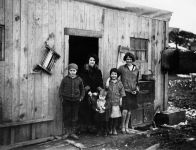 Family in a Pittsburgh slum during the Great Depression (b/w photo)