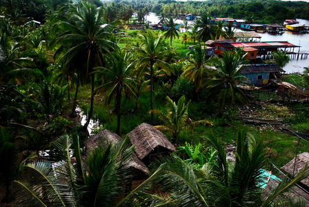 The Sinamaica lagoon is a large extension of water located northwest of Zulia state, Venezuela. The Sinamacia village inhabited by the ethnic Au Indians is one of the last floating villages on earth. They have been living in the area in houses above water known as palafitos, since pre-colonial times. They use the water body for fishing, transport, and other activities. Wooden canoes or small motor boats are used for transportation. Life in the lagoon is currently threatened by social issues such as severe poverty, water contamination and global warming. Bolivian Republic of Venezuela. March 4, 2009.  (photo)