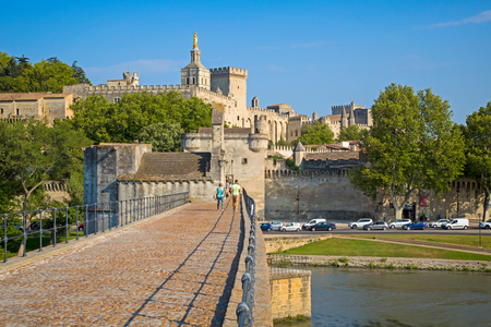 Avignon, Provence-Alpes-Côte d'Azur, France.  Palais des Papes and Pont St- Benezet.  Palace of the Popes and St. Benezet bridge. The historic centre of Avignon is a UNESCO World Heritage Site.