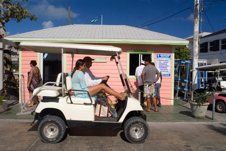 Golf car and loyalist home, Bahamas (photo)