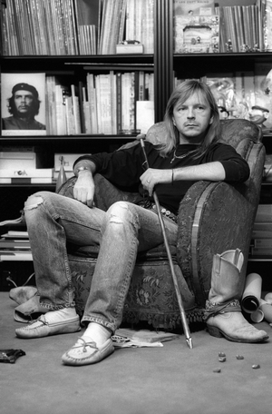 French singer Renaud (Renaud Sechan) posing for "Marchand de cailloux" album cover, 1991 (photography)