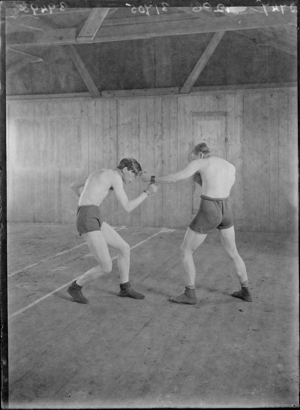 First World War Internees (Boxing) inside an Internment Hut, Douglas or Knockaloe Camp, Isle of Man, 1918 (b/w photo)