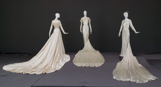 Wedding gown, 1950 (silk satin, Antonio Canovas del Castillo for Elizabeth Arden, New York), wedding dress, 1934 (silk satin, lace, rhinestones, pearls, Madame Marguerite, Chicago), and wedding gown and halo, 1938 (silk satin, Tappe, New York)