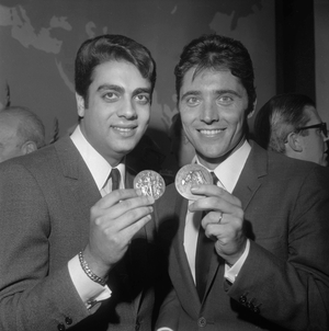 French singers Enrico Macias and Sacha Distel receiving their SACEM's medals, on April 28,1966