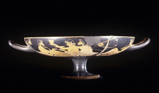 Symposium scene on red figure Attic kylix, wine cup, 5th century BC.