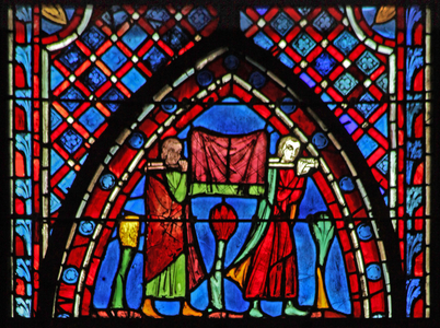 Window w7  St John: two young men bring their possessions (stained glass)