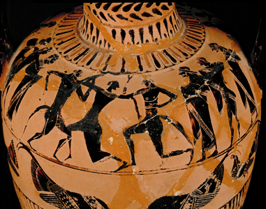Three athletes in a wrestling match …