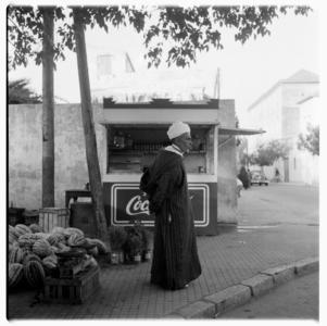 A man selling watermelons by the side of the road, Tangier, early 1960's (b/w photo)