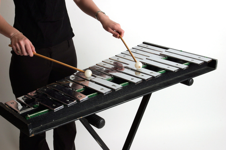 Glockenspiel with player holding