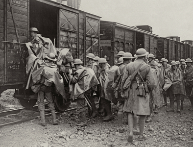 Men of a Midland Regiment boarding a train after fighting in the trenches of Flanders, 1914-18 (b/w photo)