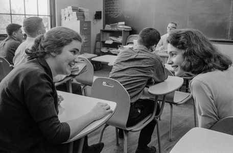 Female students socialize and chat in classroom at James A. Garfield High School, a..., 1960 (photo)