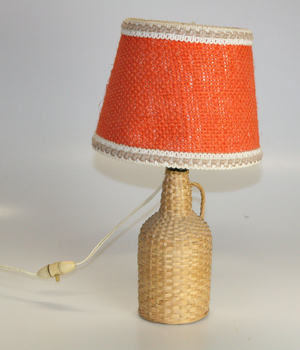 Bedside lamp on a bottle surrounded by rattan, around 1970