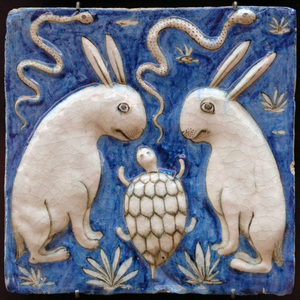 Iran / Persia: A ceramic tile with two rabbits, two snakes and a tortoise. Illustration from Zakarīyā ibn Muḥammad al-Qazwīnī, 'Ajā'ib al-makhlo