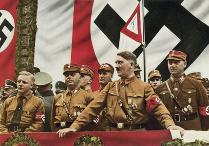 Nazi leader Adolf Hitler with Josef Wagner, Gauleiter of South Westphaliam and senior members of the SA Wilhelm Schepmann and Victor Lutze at a rally in Dortmund, Germany, 1933 (colour photo)