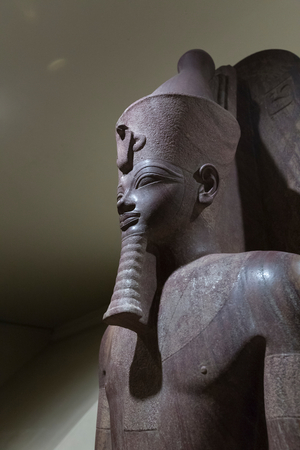 Amenhotep III standing upon the sled of Tem, Luxor statue cache (stone)