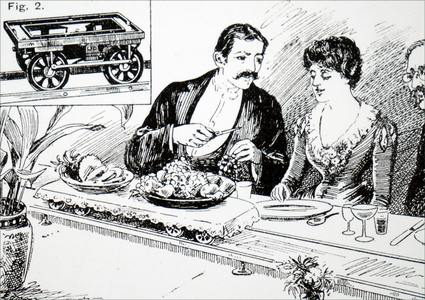 A miniature electric railway used to carry food to the dinning table