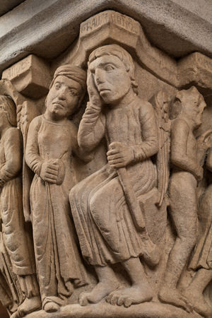 The "Capital of the Judge" or "of the Upright Judge and of the Corrupt Judge", work by Campionesi masters, XII - XIII century, Torresani Hall, Ghirlandina Tower, Modena, Italy (photo)