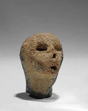 Head of a human clay figure, early middle-Neolithic (clay)