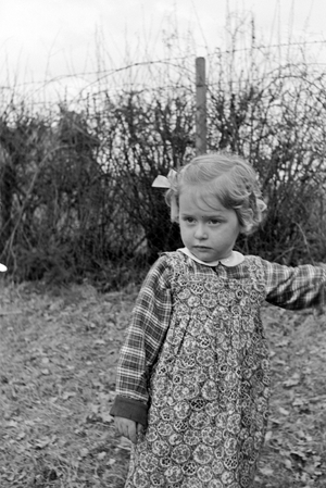 One of Knipser's quadruplet girls playing at the garden, Germany 1930s (b/w photo)