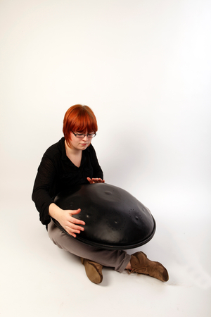 Caisa Drum, or Hang Drum, in playing position.